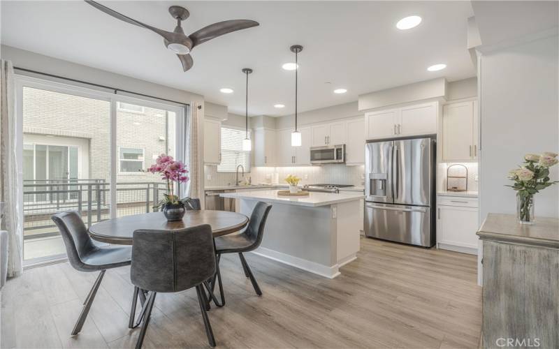 Kitchen has a breakfast bar and eating area