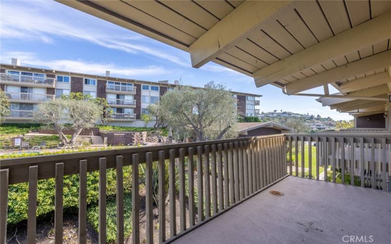 spacious balcony overlooking the HOA pool