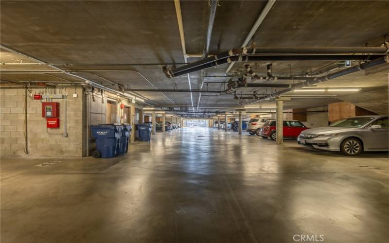 parking garage with 2 side-by-side parking spaces right off of the elevator