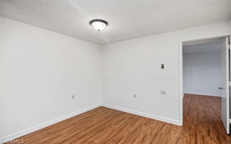 Door to primary bedroom and bath is off the dining room.