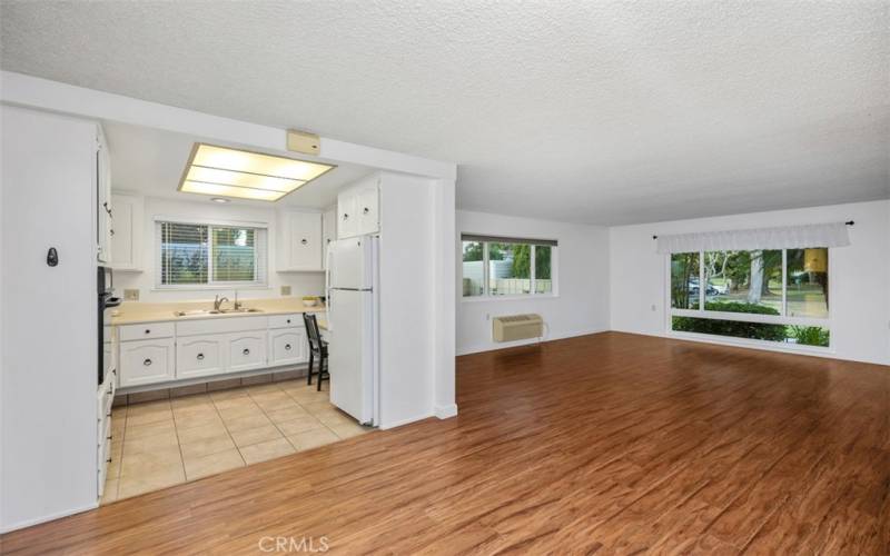 Freshly painted walls and cabinets doors, warm wood laminate flooring in most of unit.