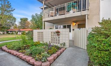 Sunny corner end unit overlooking greenbelt near to creek.  Pretty plantings in front.