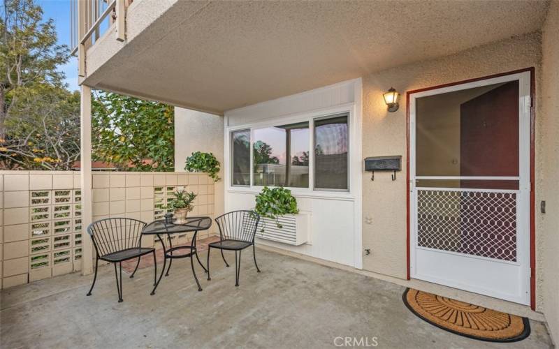 Private patio at entry is enclosed with wall and gate.