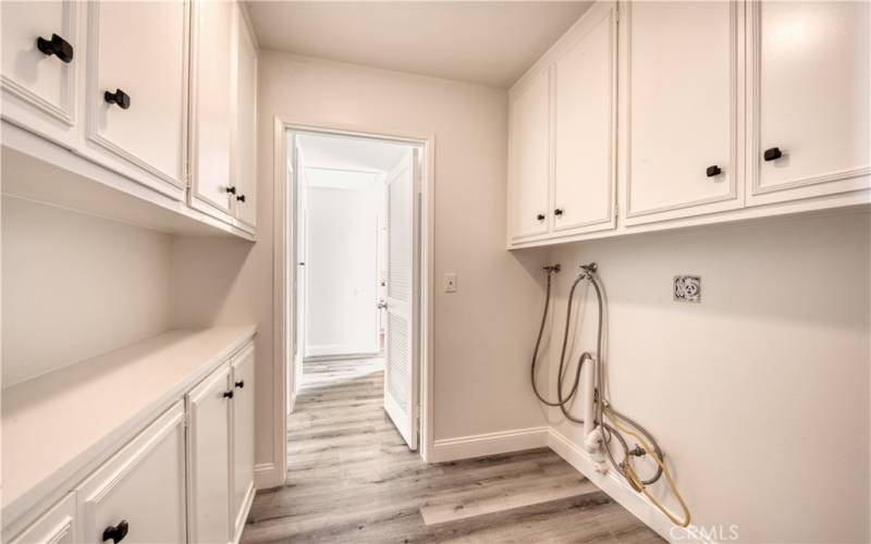 Separate laundry room with plenty of storage