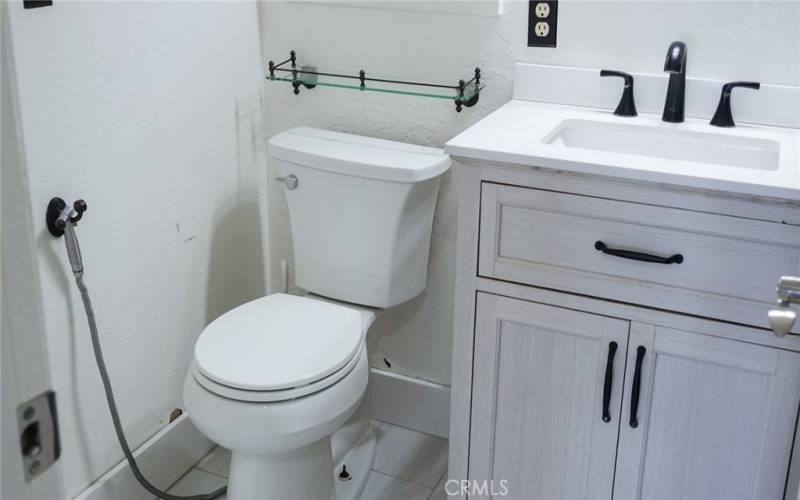 Main bathroom with sink and cabinet