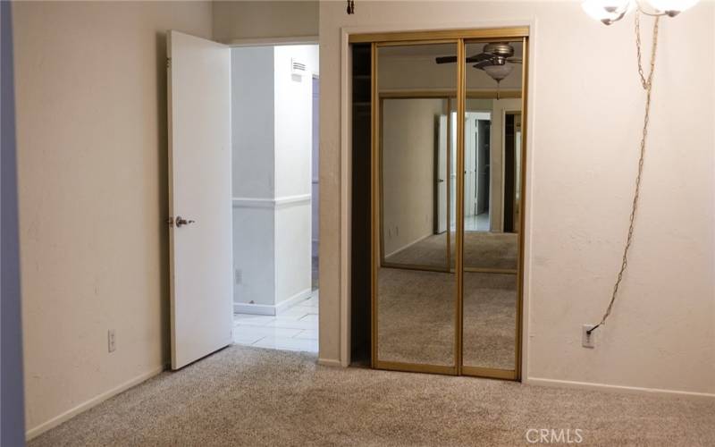 Main bedroom with mirror closet door