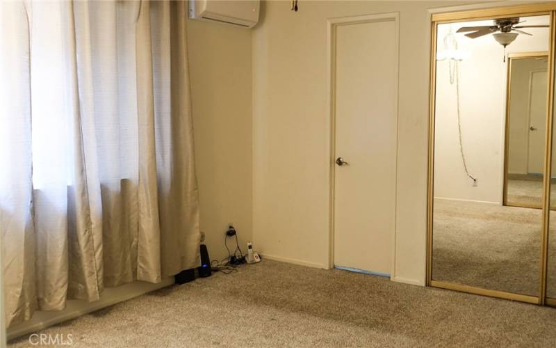 A/C unit and ceiling fan in main bedroom