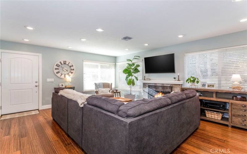 Enter the home to the Family Room with fireplace and Bamboo flooring throughout