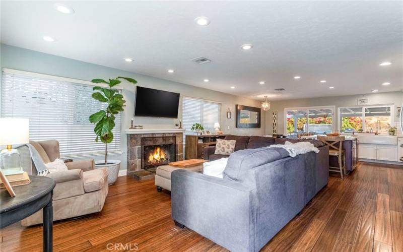 Looking from the Family Room to the open Dining area and Kitchen