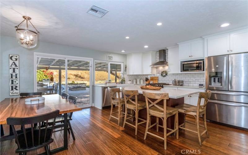 Kitchen, Dining Room looking out the sliding door to entertaining backyard