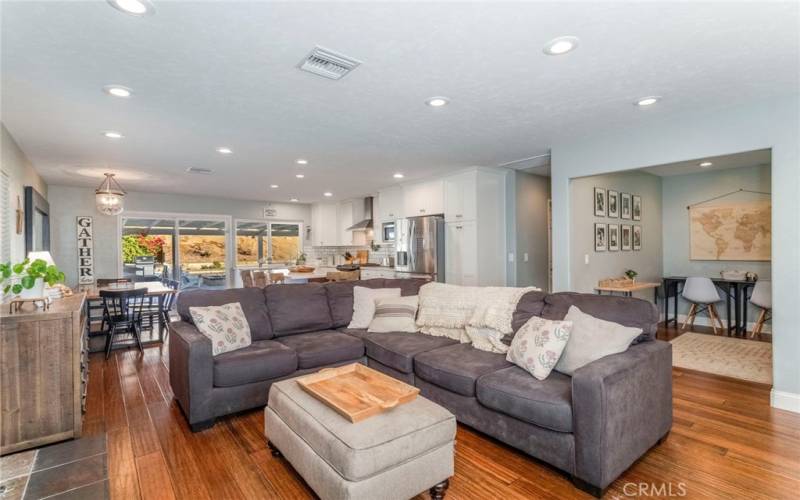 Looking from the Family Room to the Kitchen/Dining Room and sliding doors to the expansive back yard