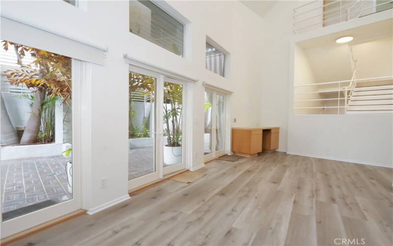 Family Room with French Doors leading to Spacious Outdoor Entertaining Area