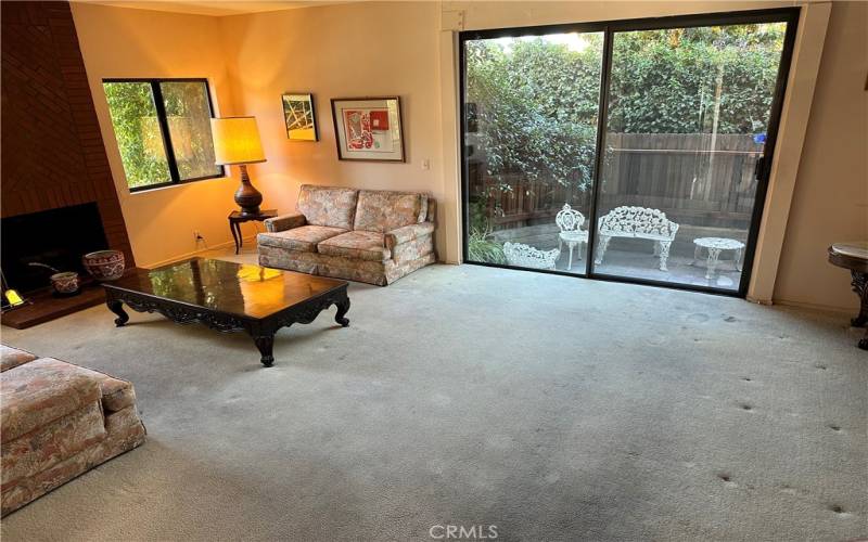 Living Room with Fireplace and Patio