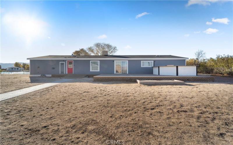 Front of house with built in BBQ and deck