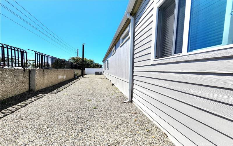 Big yard that has vinyl fencing.