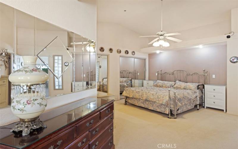 Primary bedroom with recessed alcove & lighting