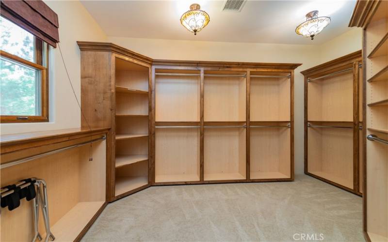 master suite walk-in closet with organizers