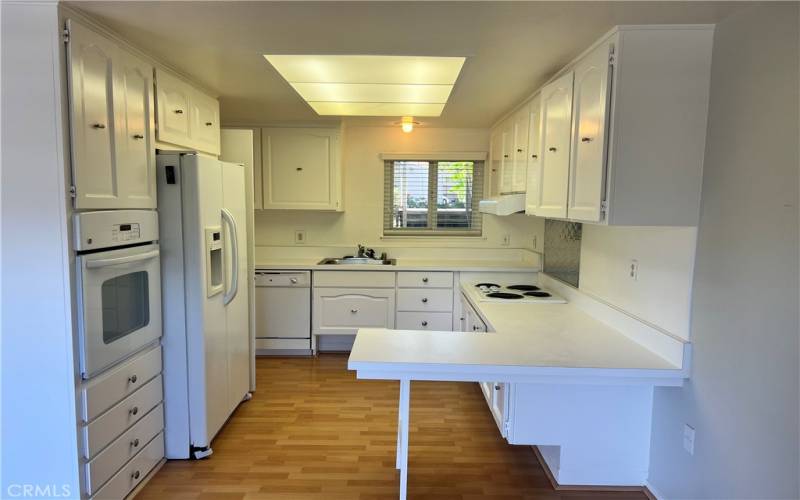 Kitchen including fridge, stove, oven and dishwasher