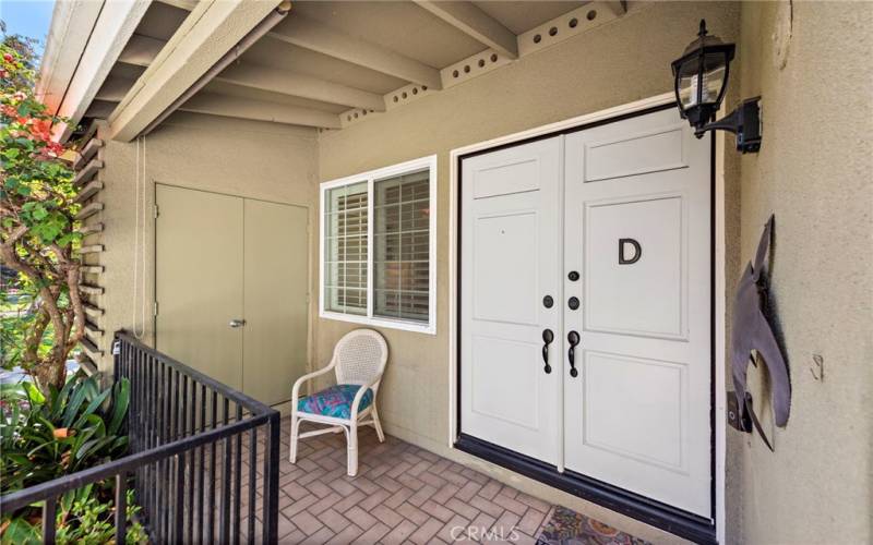 Greeted by a grand double door entrance with private covered patio