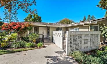 Welcome to 80 Calle Aragon Unit D end unit with private terrace and covered patio surrounded by mature landscaping and amazing amenities in one of the most vibrant 55+ communities in Souther California