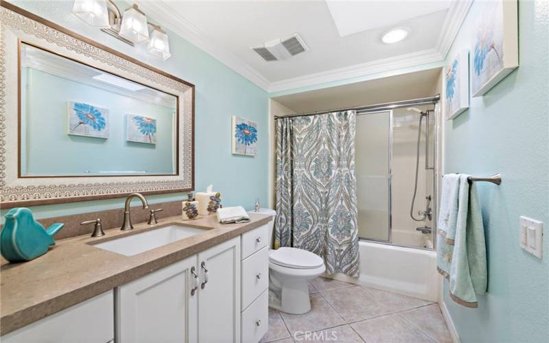 Beautiful guest hallway bathroom with tub/shower combo and skylight.  Rare options in this model with two bathrooms allowing for a guest bathroom and a separate primary bathroom.