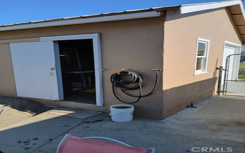 side of the garage. Garage is 1 car but has storage of a 2 car garage