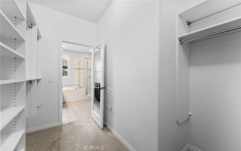 The large walk-in closet for the primary bedroom has excellent lighting, NEW custom washable paint and plush designer carpeting! 
