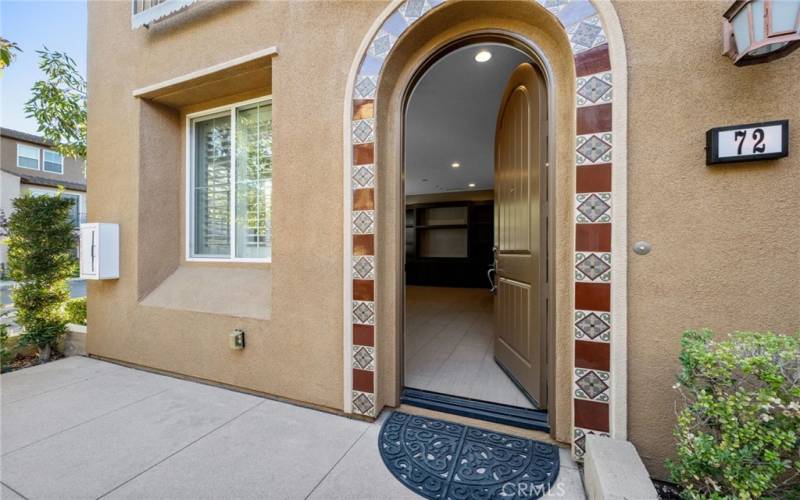 Appealing front entry and front patio with electrical outlet for lighting or a fountain.