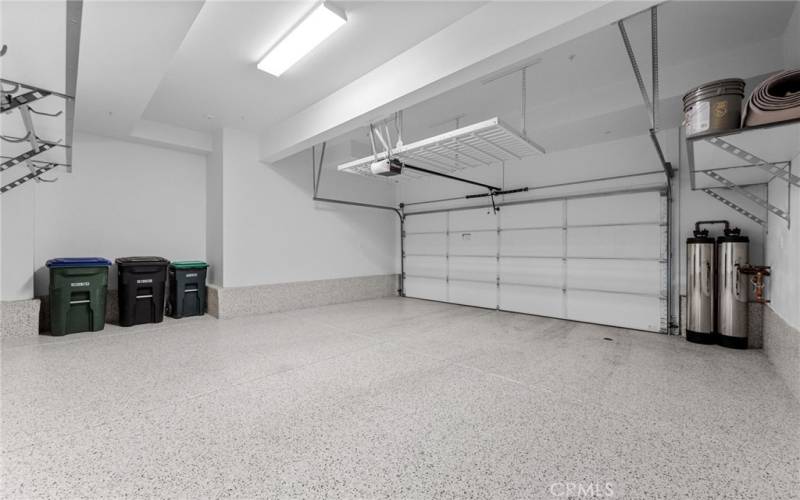 The extra large 2-car garage is highly upgraded and includes epoxy flooring, heavy duty adjustable wall storage shelves, ceiling storage, lighting and NEW premium washable paint!