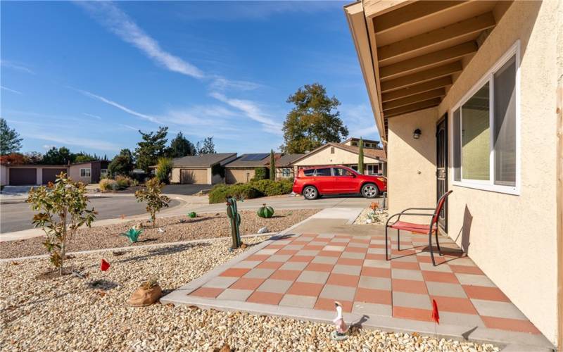 Carefully curated front yard, this is a low-to-no maintenance yard with a carefully planned hardscape. Nothing haphazard here! You can enjoy the beauty of the yard without the cost and hassle of a lawn. There are two lovely magnolia trees to enjoy. Put a patio set with table and chairs on the paved patio and sip your coffee in the morning or a beverage in the evening.