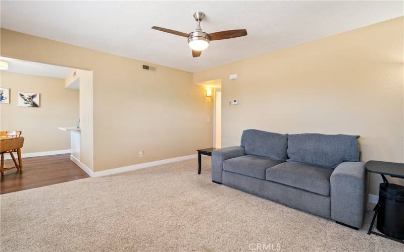 To the hallway, notice the subtle and neutral carpet and paint colors.