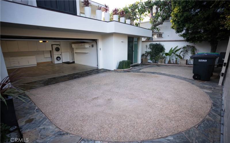 Rear gated courtyard accommodates 2 cars in garage and 2-3 cars in courtyard.