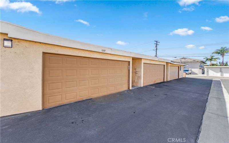 Private two car garage with direct access to the patio courtyard entrance.