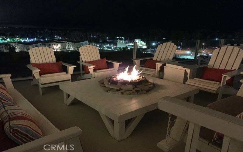 Fire pit on the deck at night.