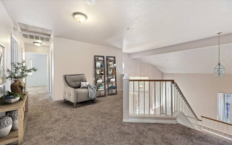 Loft area at the top of the stairs, virtual staged.