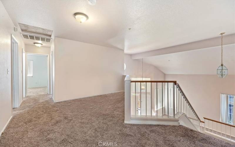 Loft area at the top of the stairs.