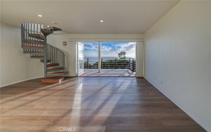 Stairs to the lower level bedroom, ensuite bath and laundry