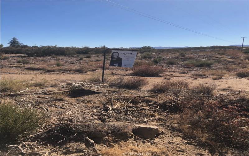 For sale sign on upper left corner property line