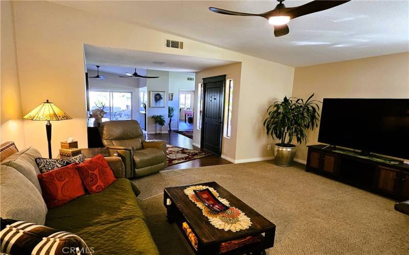 view from living room to family room and kitchen