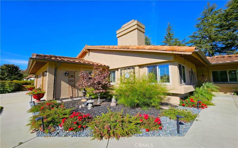 Corner of home, nicely landscaped, three car garage