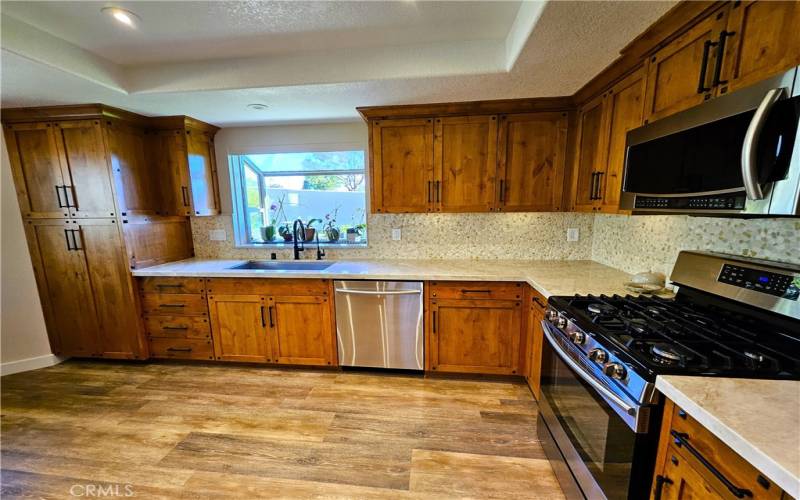 pantry area on left with pull out drawers