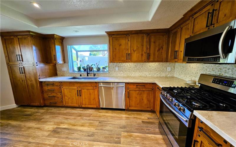 pantry area on left with pull out drawers