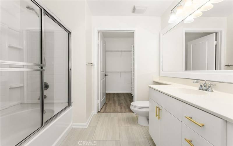 with tile flooring, a full shower + tub