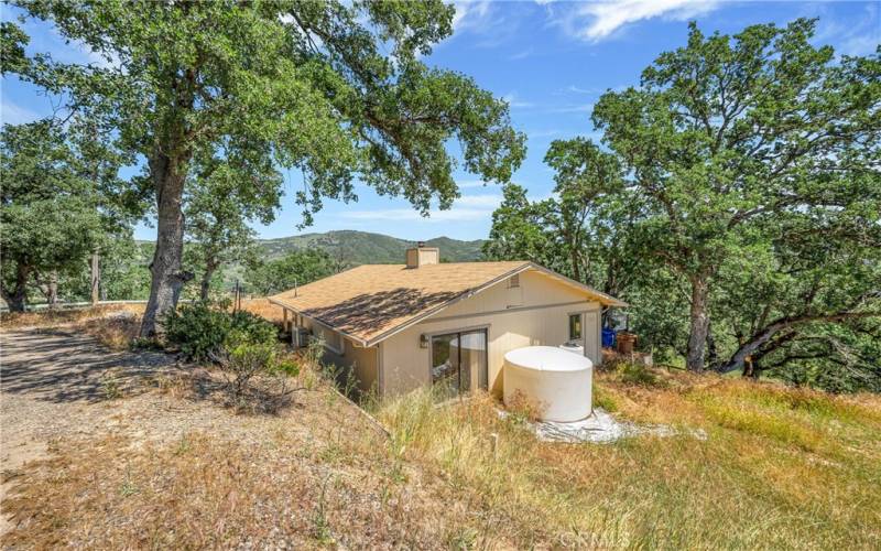 House is nestled into the terrain for cozy feeling and privacy