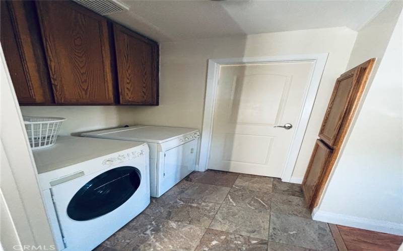 Laundry from bathroom looking toward bedroom.