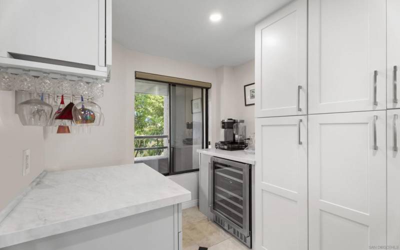 Beverage center and pantry with wine refrigerator.