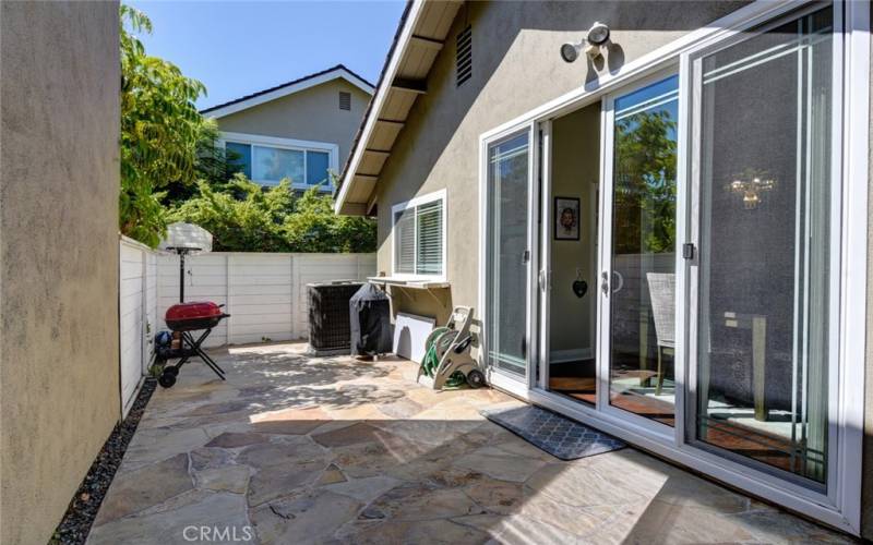 The patio space extends in front of the dining area and the kitchen.