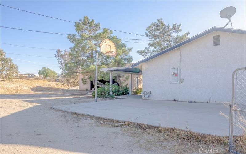 Side yard with concrete slab