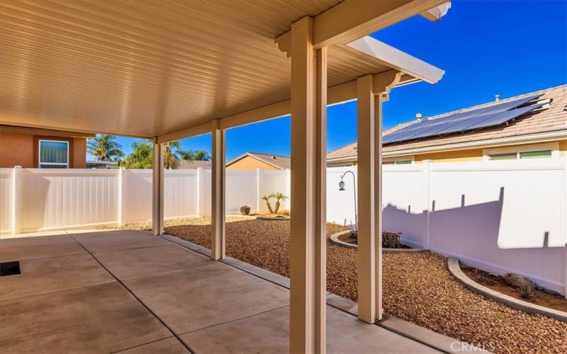 Covered patio.  Low maintenance back yard.  Vinyl fencing.