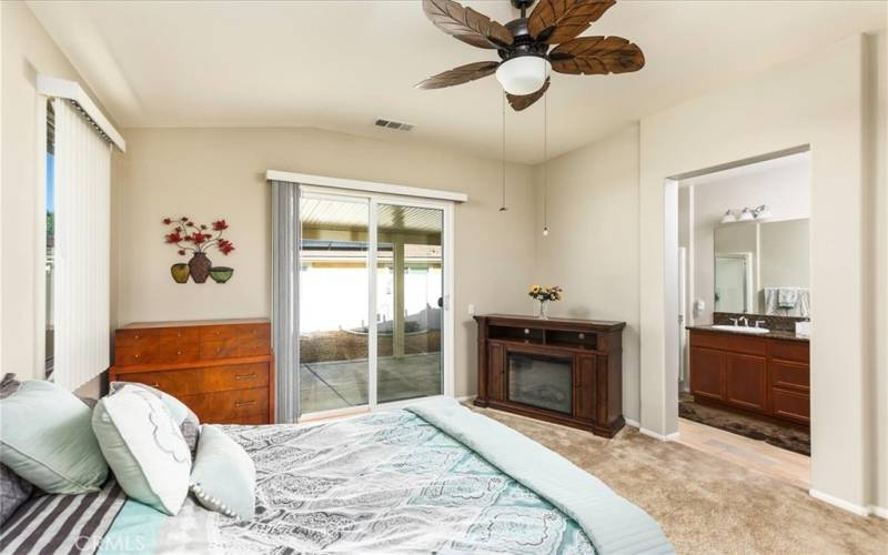 Primary bedroom with adjoining bath.  Attractive ceiling fan.